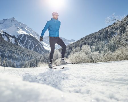 Austria, Tyrol, Luesens, Sellrain, cross-country skier in snow-covered landscape